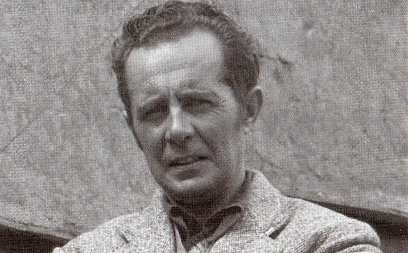 Black-and-white portrait of a man in a tweed jacket