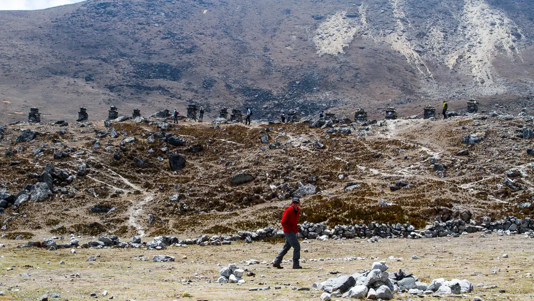 Thukla memorial and a Trekker in Everest region