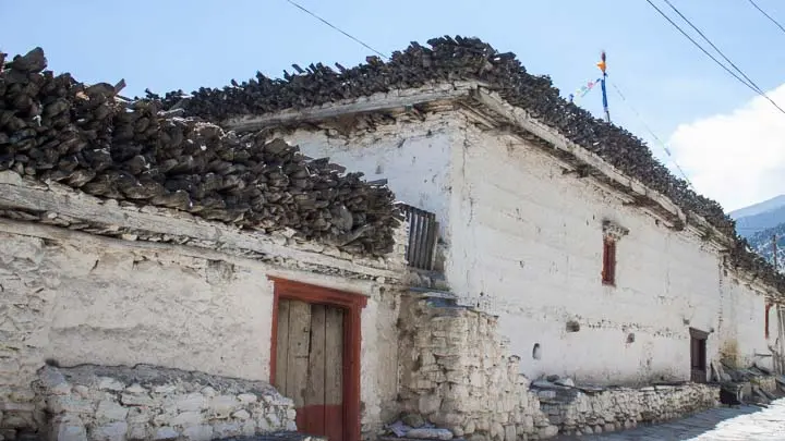 Wood Logs On House Roofs