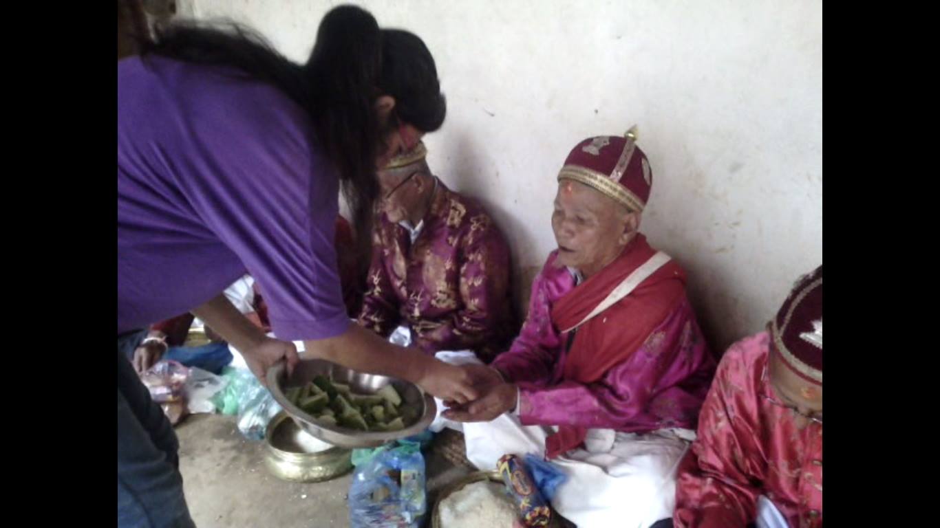 People giving away five 'things' to Buddhist priests