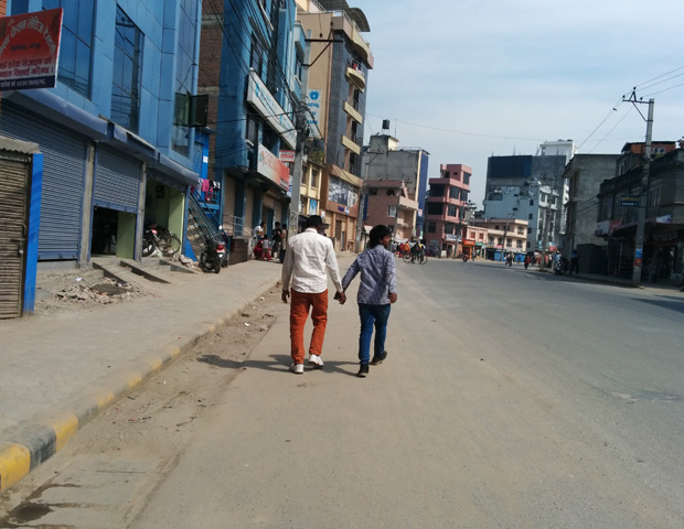 Guys holding hands in streets of nepal