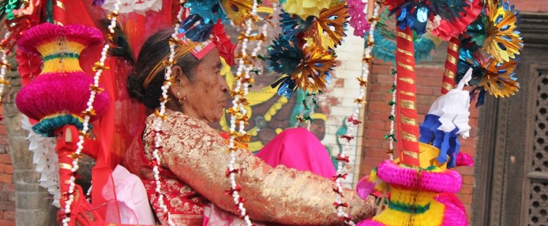 An old woman being paraded around town during Janku
