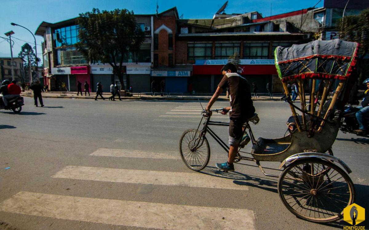 Rickshaw driver waiting for a passenger in Durbarmarg, Nepal