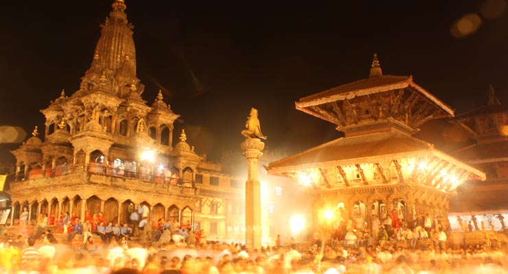 Krishna Mandir being illuminated by lights on the night of Krishna Janmashtami