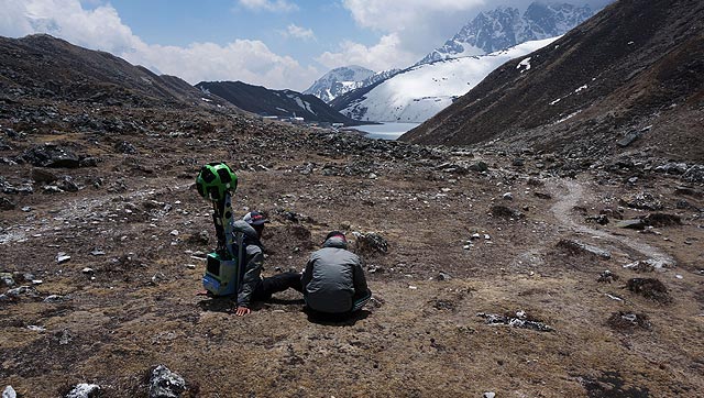 Memebers of the Google Street View project sit with the camera used to capture project footage in Nepal's Khumbu region. Photo: AFP